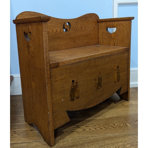 430 - A good Arts and Crafts oak Liberty & co hall Settle / Seat, backrest with pierced yin-yang decor... 