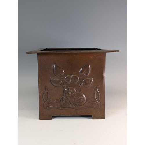 394 - Glasgow school an Arts and Crafters copper Planter, embossed with stylised floral designs and with b... 