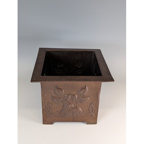 394 - Glasgow school an Arts and Crafters copper Planter, embossed with stylised floral designs and with b... 