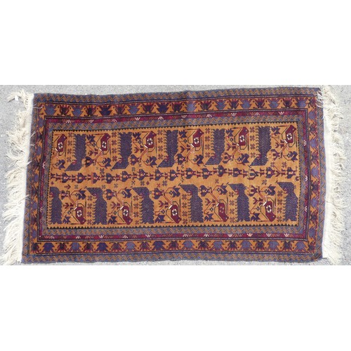 546 - Tribal Rugs; a hand-knotted Afghan War Rug, wool pile on wool base, the dark ochre-ground with repea... 