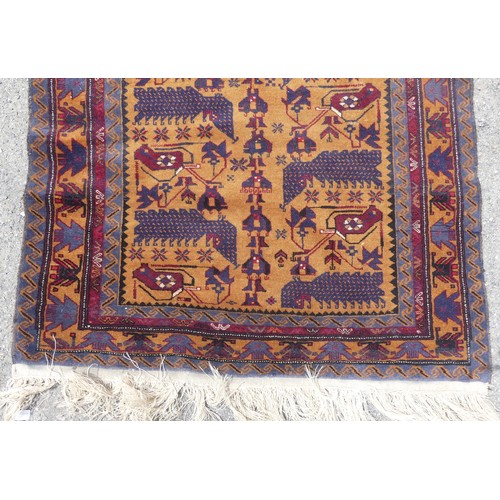 546 - Tribal Rugs; a hand-knotted Afghan War Rug, wool pile on wool base, the dark ochre-ground with repea... 