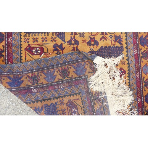 546 - Tribal Rugs; a hand-knotted Afghan War Rug, wool pile on wool base, the dark ochre-ground with repea... 