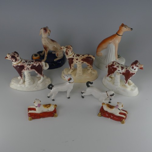 14 - A pair of antique Staffordshire pottery figures of Pugs, seated on red cushions, H 4.2cm, together w... 