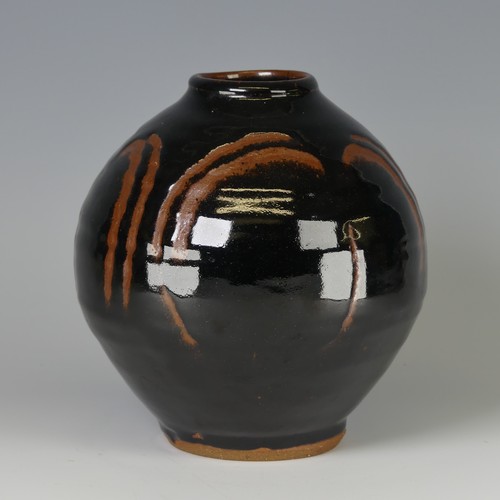 44 - Mike Dodd (b. 1943) a studio pottery Vase, of bulbous form, with tenmoku glaze over wax resist decor... 