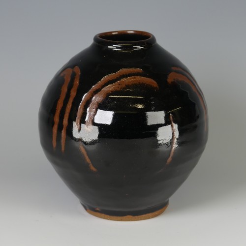 44 - Mike Dodd (b. 1943) a studio pottery Vase, of bulbous form, with tenmoku glaze over wax resist decor... 