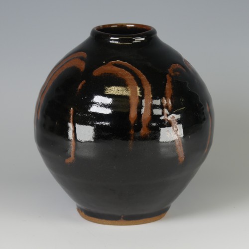 44 - Mike Dodd (b. 1943) a studio pottery Vase, of bulbous form, with tenmoku glaze over wax resist decor... 