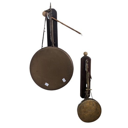 407 - An Arts and Crafts wall dinner Gong, in the form of a Dutchman, with striker, together with another ... 