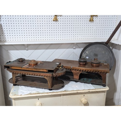 413 - An Army & Navy copper Hot Plate, together with three other copper Hot Plates and associated burn... 