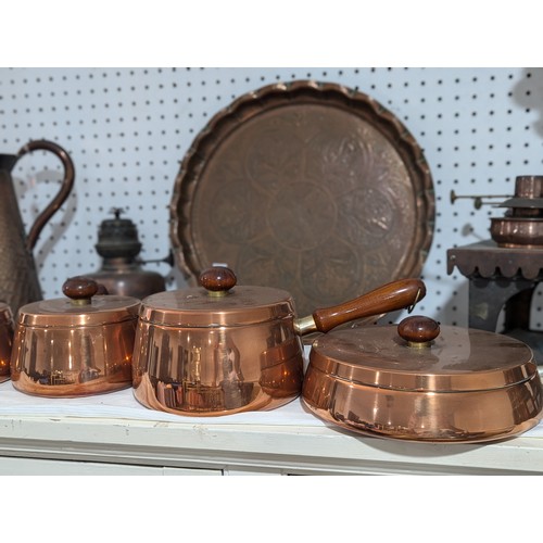 413 - An Army & Navy copper Hot Plate, together with three other copper Hot Plates and associated burn... 