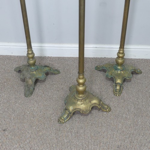 417 - A set of three Victorian brass standard Lamps, having a scrolled single sconce over a central cylind... 