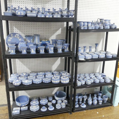 57 - A very large quantity of Wedgwood blue Jasperwares, comprising Vases, Bowls, Jugs, Trinket Boxes, et... 