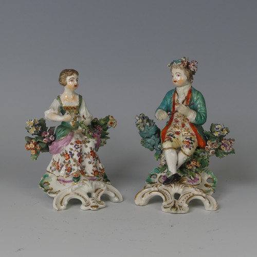 60 - A pair of 18thC English porcelain Figurines, possibly Derby, modelled as children, one holding flute... 