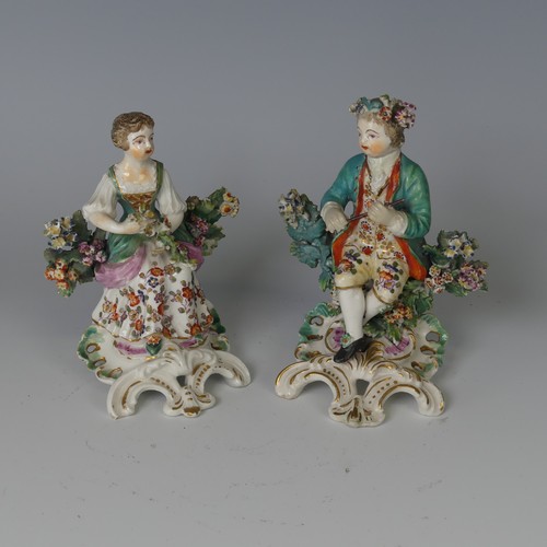 60 - A pair of 18thC English porcelain Figurines, possibly Derby, modelled as children, one holding flute... 