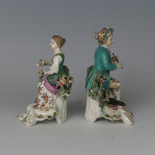 60 - A pair of 18thC English porcelain Figurines, possibly Derby, modelled as children, one holding flute... 