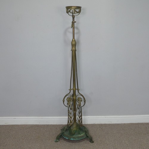 420 - A late 19th century ornate telescopic brass standard Lamp, decorated in relief with scrolls, raised ... 