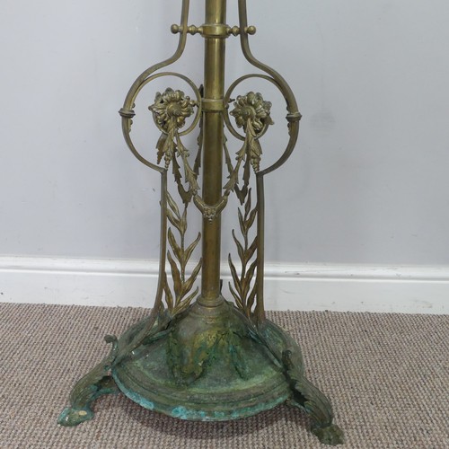 420 - A late 19th century ornate telescopic brass standard Lamp, decorated in relief with scrolls, raised ... 