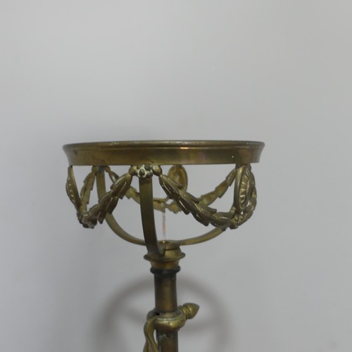 420 - A late 19th century ornate telescopic brass standard Lamp, decorated in relief with scrolls, raised ... 