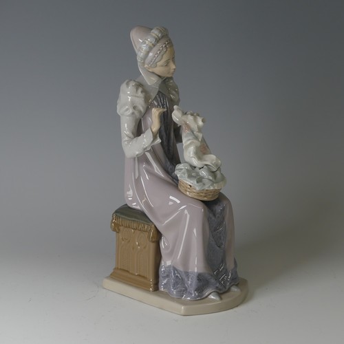 61 - A Lladro figure of a Medieval Lady, modelled seated doing embroidery, 5126, marks to base, H 29cm.... 