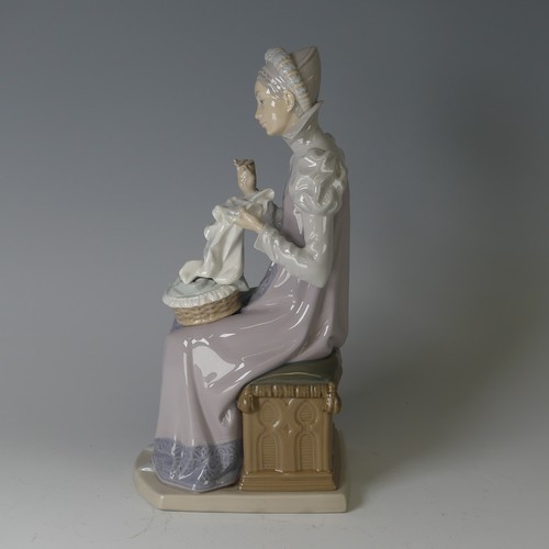 61 - A Lladro figure of a Medieval Lady, modelled seated doing embroidery, 5126, marks to base, H 29cm.... 