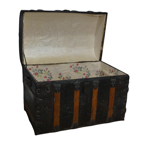 421 - An antique metal and oak bound dome-topped Trunk / Chest, the trunk and hinged lid with oak bound st... 