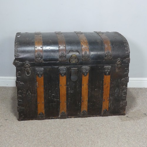 421 - An antique metal and oak bound dome-topped Trunk / Chest, the trunk and hinged lid with oak bound st... 