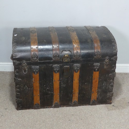 421 - An antique metal and oak bound dome-topped Trunk / Chest, the trunk and hinged lid with oak bound st... 