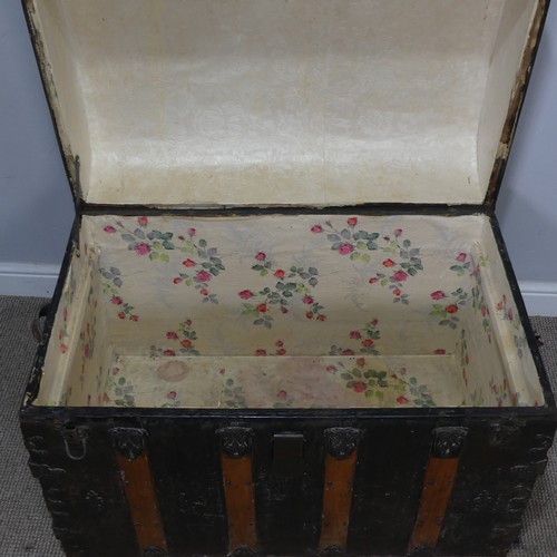 421 - An antique metal and oak bound dome-topped Trunk / Chest, the trunk and hinged lid with oak bound st... 