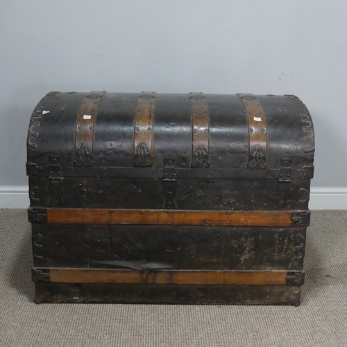 421 - An antique metal and oak bound dome-topped Trunk / Chest, the trunk and hinged lid with oak bound st... 