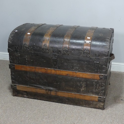 421 - An antique metal and oak bound dome-topped Trunk / Chest, the trunk and hinged lid with oak bound st... 