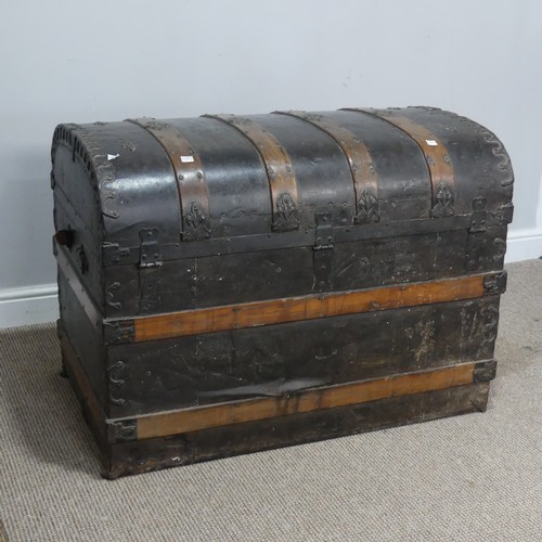 421 - An antique metal and oak bound dome-topped Trunk / Chest, the trunk and hinged lid with oak bound st... 