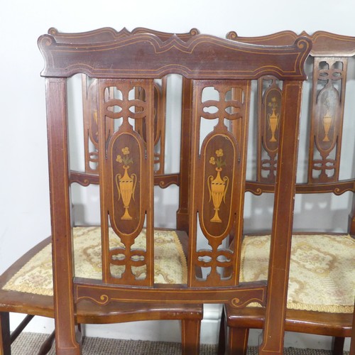 423 - A set of four Edwardian mahogany and inlaid Parlour Chairs, backrest inlaid with flowered urns, abov... 