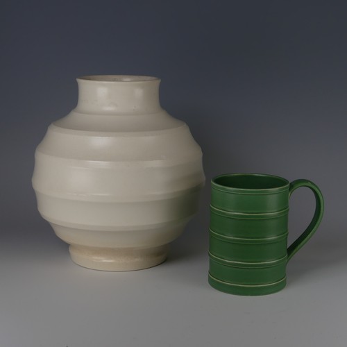 64 - Keith Murray for Wedgwood Tankard, decorated in Matt Green glaze with banded tapering cylindrical bo... 