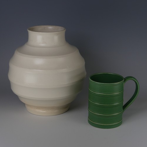 64 - Keith Murray for Wedgwood Tankard, decorated in Matt Green glaze with banded tapering cylindrical bo... 