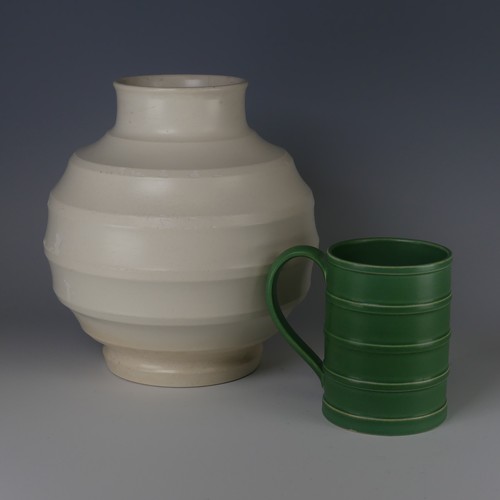 64 - Keith Murray for Wedgwood Tankard, decorated in Matt Green glaze with banded tapering cylindrical bo... 