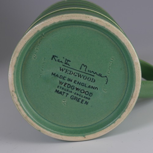 64 - Keith Murray for Wedgwood Tankard, decorated in Matt Green glaze with banded tapering cylindrical bo... 