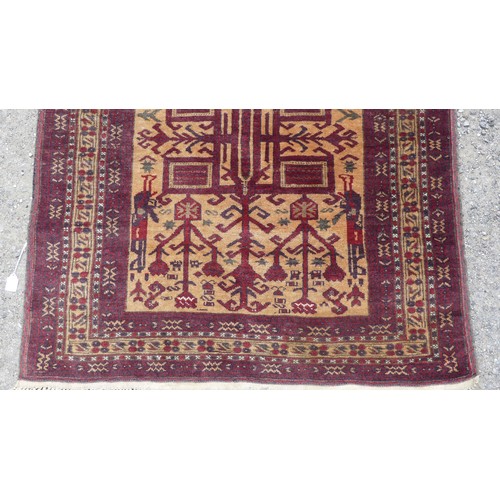 547 - Tribal Rugs; a hand-knotted Afghan War Rug in the form of a Prayer Rug, wool pile on wool base, the ... 