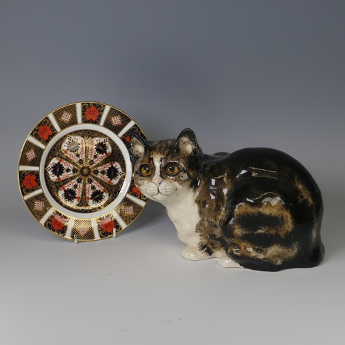 67 - A Jenny Winstanley studio pottery Cat, modelled in recumbent pose, pen marks to base, H 20cm togethe... 