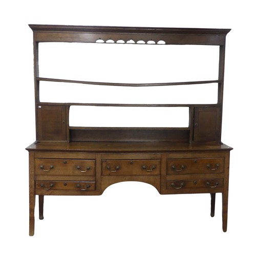 426 - A 19th century oak dresser Base, with associated plate rack, moulded cornice over pierced frieze and... 