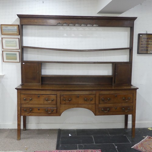 426 - A 19th century oak dresser Base, with associated plate rack, moulded cornice over pierced frieze and... 