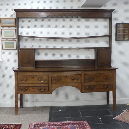 426 - A 19th century oak dresser Base, with associated plate rack, moulded cornice over pierced frieze and... 