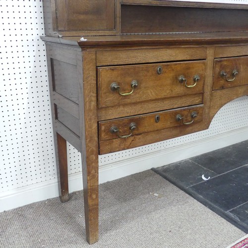 426 - A 19th century oak dresser Base, with associated plate rack, moulded cornice over pierced frieze and... 