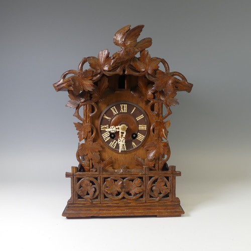 310 - A late 19th Century Black Forest carved softwood mantel cuckoo Clock, by Gordian Hettich Sohn, with ... 