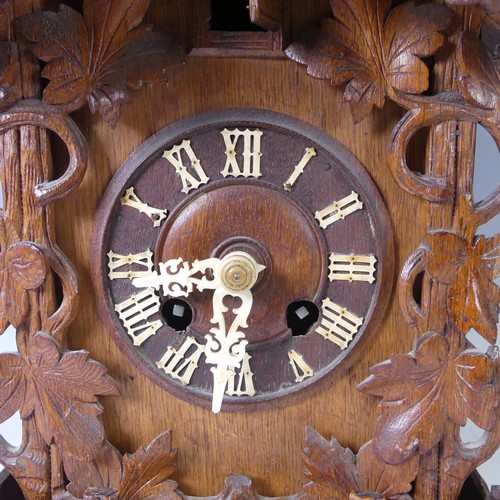 310 - A late 19th Century Black Forest carved softwood mantel cuckoo Clock, by Gordian Hettich Sohn, with ... 