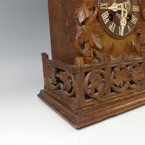 310 - A late 19th Century Black Forest carved softwood mantel cuckoo Clock, by Gordian Hettich Sohn, with ... 