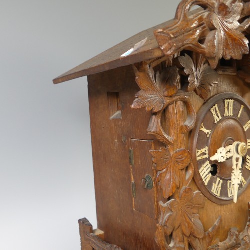 310 - A late 19th Century Black Forest carved softwood mantel cuckoo Clock, by Gordian Hettich Sohn, with ... 