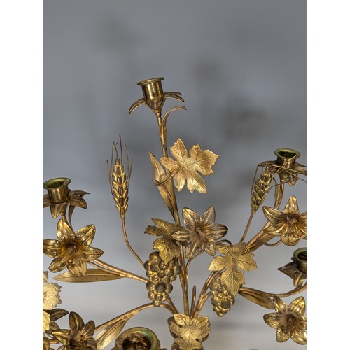 429 - An unusual set of three early 20th century gilt metal floral Candelabra, each with three candlestick... 