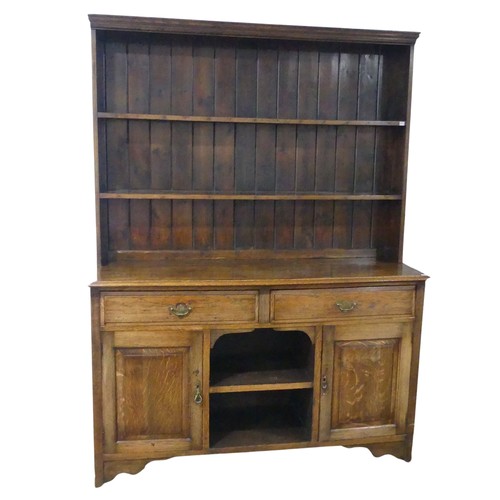 434 - An early 20th century oak Dresser, two shelves over base, W 152 cm x H 203 cm x D 49 cm.... 