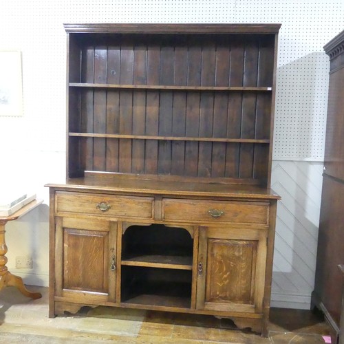 434 - An early 20th century oak Dresser, two shelves over base, W 152 cm x H 203 cm x D 49 cm.... 