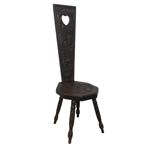 436 - An antique carved oak spinning Chair, pieced heart backrest, W 31 cm x H 95 cm x D 31 cm.... 