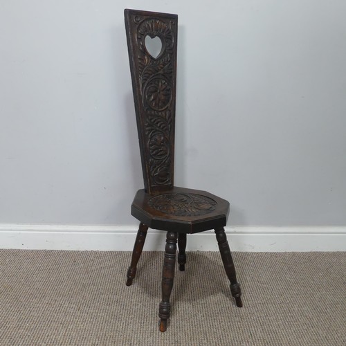 436 - An antique carved oak spinning Chair, pieced heart backrest, W 31 cm x H 95 cm x D 31 cm.... 